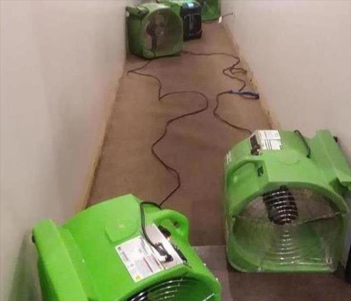 SERVPRO equipment in the hall of a business